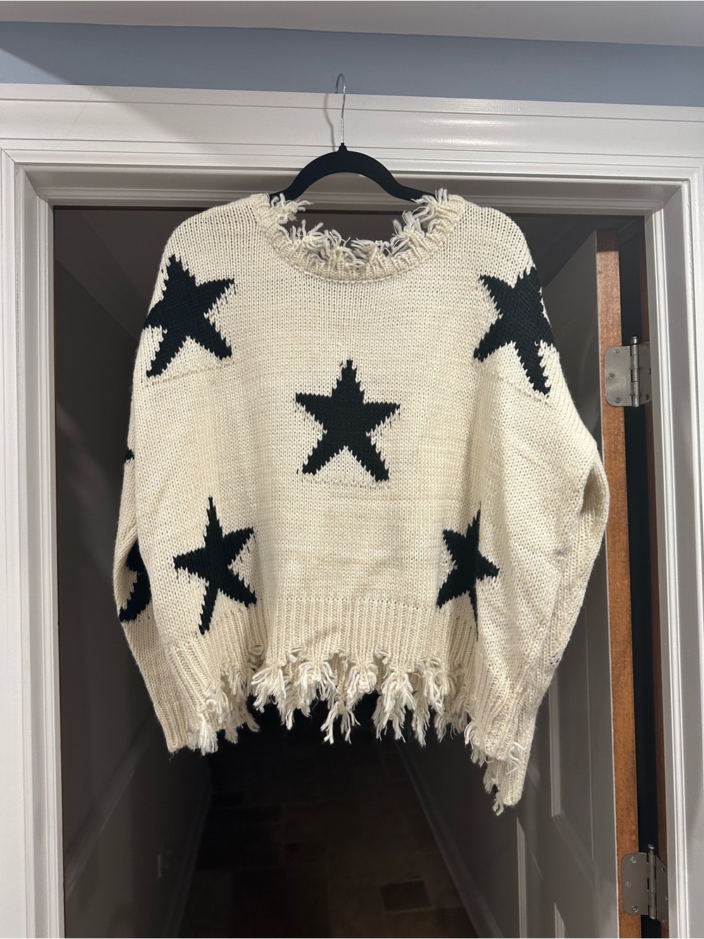 Miracle Cream Crewneck Sweater with Black Star Motif